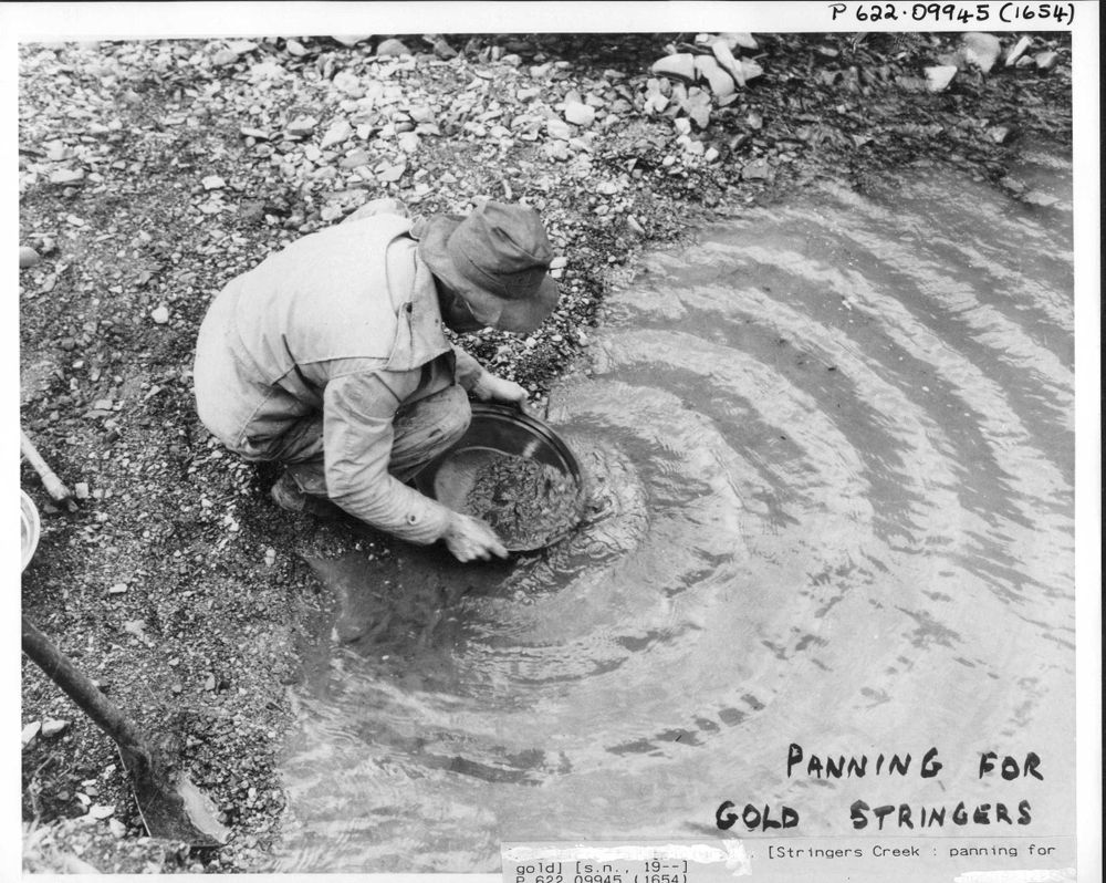 photo of a man panning for gold