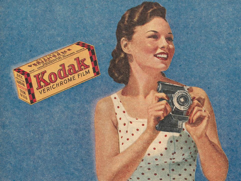a 1940s ad of a woman with a camera and the word 'kodak'