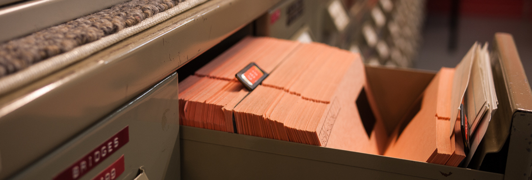 Microfilm records in the PROV repository An open drawer holding microfilm records