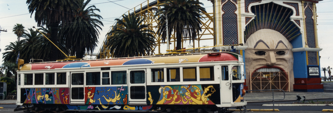 A tram featuring Michael Luenig's artwork, VPRS 12620/P4 Unit1 A colourful tram near Lunar Park