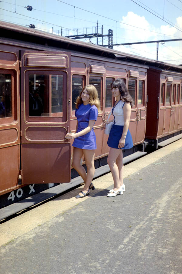Women in the 1970s getting on a train 