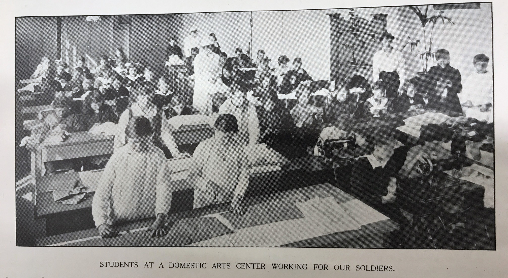 photo of school children working at benches