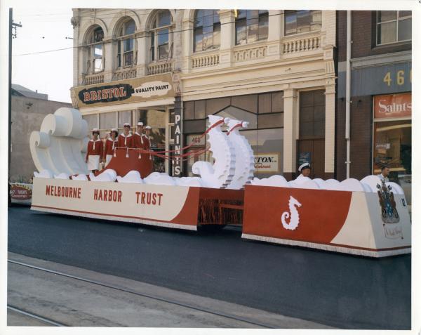 a float of red and white with women in uniform