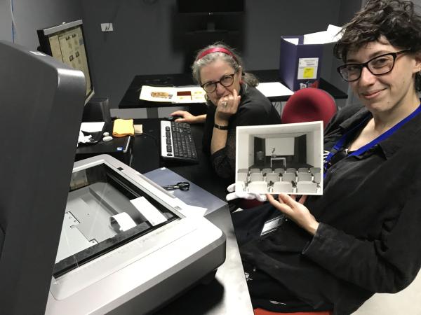 two volunteers with a photo they digitised